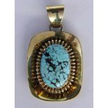 A PENDANT 585/000 yellow gold with turquoise. 4 cm long, gross weight approximately 9.