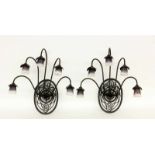 A PAIR OF WALL LAMPS IN ART DECO STYLE Gabriel Milesi, Perouges Blackened wrought ironframe with 6
