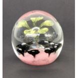 A PAPERWEIGHT Colourless glass with fusion. With label: ''Cristallerie Hartzviller. Faitmain''. 9.