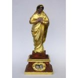 SAINT WITH RELIC probably France, 18th century Praying saint on baroque base withcartridge in