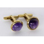 A PAIR OF CUFFLINKS 333/000 yellow gold with amethysts. Gross weight approximately 12.8gramsPAAR