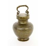 A TEA VESSEL WITH SCREW-ON LID China. Brass with chased decoration. 21 cm high.TEEGEFÄSS MIT