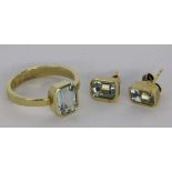 A LADIES RING AND A PAIR OF STUD EARRINGS 585/000 yellow gold and aquamarines. Ring size56, gross