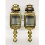A PAIR OF CARRIAGE LAMPS 20th century Brass electric wall lamps with glazing on 3 sides.Inscribed:
