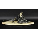 AN ART DECO WOMAN WITH PHEASANT France, 20th century Black patinated and painted castmetal. Face and