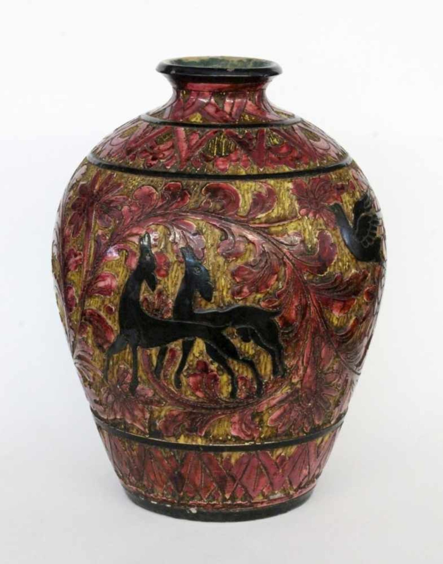 A DECORATIVE VASE Glazed ceramic with surrounding relief decoration with animals andplants. 27 cm