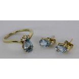A LADIES RING AND A PAIR OF STUD EARRINGS 585/000 yellow gold with fine aquamarines anddiamonds.
