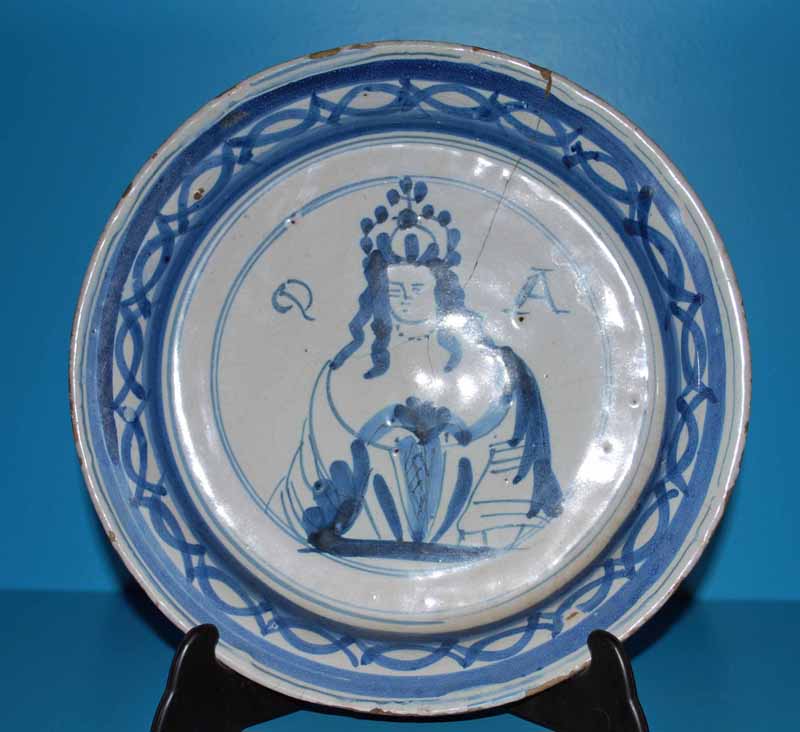 An early 18th century Queen Anne blue and white Delft Dish, centrally with Queen Anne portrait