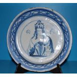 An early 18th century Queen Anne blue and white Delft Dish, centrally with Queen Anne portrait