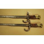 Two French pattern M1874 sword bayonets for use on the 11mm M1874 Gras rifle, one dated 1879