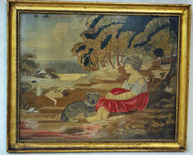 An 18th century silk and stumpwork embroidered picture, Rural Summer Landscape with a young woman