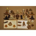 A good selection of Royal Artillery and Military Police Cap and Collar badges including brass &