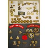 A good selection of South Lancashire Regiment Badges including Hat, Collar and Shoulder badges