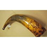 A 17th century scrimshaw decorated powder horn, made from the horn of a large steer with the broad