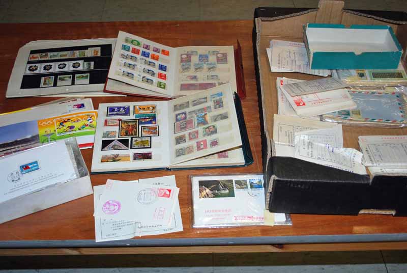 A large collection of China, Hong Kong and Malaya Postcards, Stamps and Ephemera, nine albums of