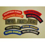 Guards Cloth Shoulder Titles and Khaki Slipons including IG, IRISH GUARDS, WELSH GUARDS, CG, SCOTS