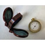 An early 20th century pocket Barometer with Thermometer and Compass on the reverse, silvered