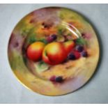 A Royal Worcester hand painted Cabinet plate, decorated with fruit against a naturalistic ground,