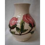 A modern Moorcroft Pottery Vase of baluster shape, tubeline decorated with flowering Magnolia on a