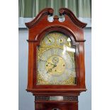 An early 20th century mahogany three train chiming Longcase Clock, arch top silvered brass face with