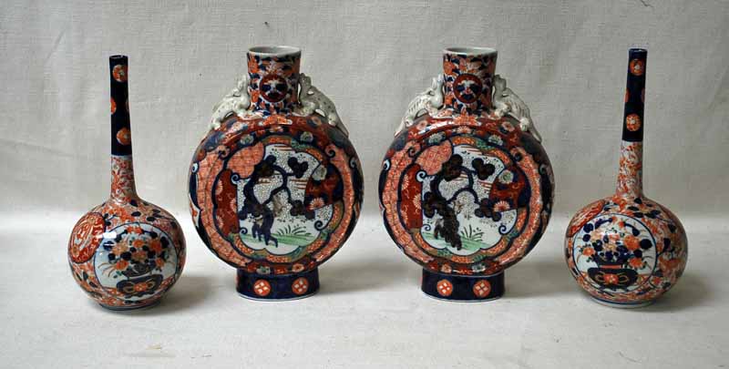 A pair of Japanese Imari Moonflasks of typical form with Dragon handles, 25cm high and a pair of