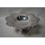 An early 20th century silver footed Fruit Stand of shaped flower head form on circular foot,