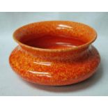 A Royal Lancastrian orange glaze Bowl, compressed circular form with everted rim, impressed