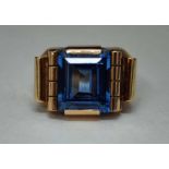 A Continental Gold and Sapphire Ring, the unmarked shank tests as 18ct, the facetted step cut