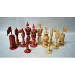 A late 19th/early 20th century set of Ivory Chess Men, sixteen natural and sixteen red dyed (faded),
