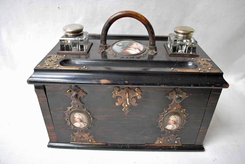 A good quality Victorian brass mounted coromandel Desk Box, the rectangular top with brass hoop