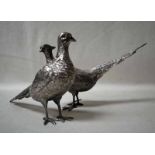 A mid/late 20th century pair of silver table models of Pheasants, each hallmarked London 1965, 28.