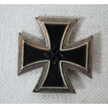 A WWII Nazi Germany Iron Cross First Class, magnetic Iron Cross cast with a Swastika and 1939 in a