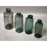 Four small 18th century hand blown Glass Apothecary bottles of cylindrical form, pushed up bases