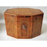 A Regency style multi wood inlaid Tea Caddy of elongated hexagonal form, the crossbanded hinged