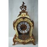 A French reproduction Boulle Style Mantel Clock, waisted form with ivory painted crackle finish,