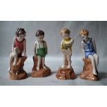 Four rare Royal Doulton Figures of Children, in prototype colourways, two girls in bathing costume