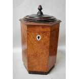 A burr walnut Caddy of hexagonal form, the hinged lid with rosewood top surmounted with a turned