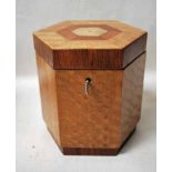 An inlaid mahogany and walnut Tea Caddy of hexagonal form, the string and marquetry inlaid hinged