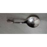 A mid-20th century Georg Jensen silver ornamental Caddy Spoon, circular bowl, beaded looped