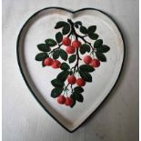 A Wemyss Ware 19th century heart shape Dish hand painted with Cherries and Leaves on a branch,