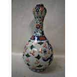 A late 19th century Chinese Bottle Vase of typical pear shape with expanded neck, white porcelain