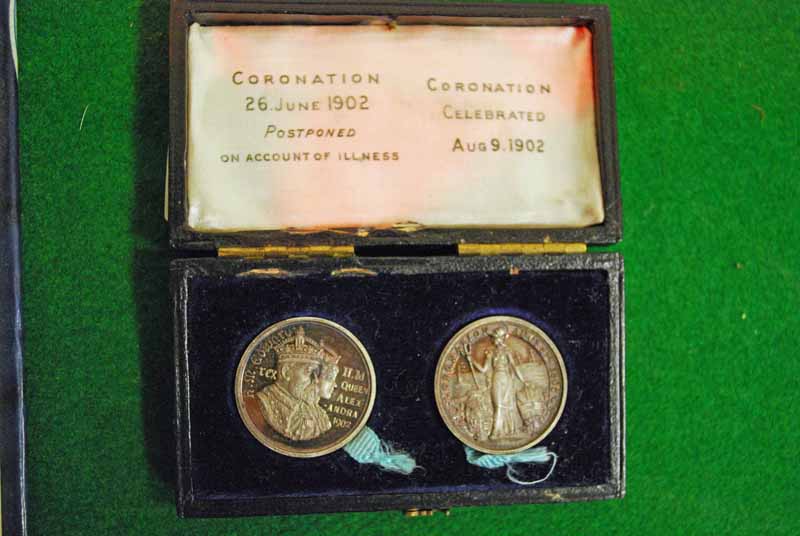 A pair of silver 1902 Coronation Medals, one for the postponed event on 26 June, the other for the