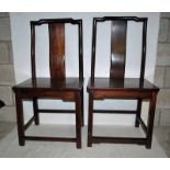 A pair of late 19th century Chinese Hardwood Stand Chairs, yoke shape top rail, solid vertical