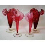 A pair of early 20th century Cranberry Glass Vases, fluted spiral body with folded and frilled rim
