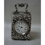 A Victorian silver cased miniature Carriage Clock, white circular enamel dial with Roman numerals,