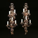 A PAIR OF CONTINENTAL GLASS MOUNTED SIX LIGHT GILT WROUGHT IRON WALL SCONCES, POSSIBLY ITALIAN,