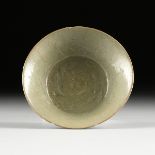 A CHINESE LONGQUAN TYPE CELADON GLAZED RELIEF CARVED EARTHENWARE BOWL, IN THE SONG DYNASTY (960-