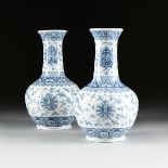 A PAIR OF CHINESE BLUE AND WHITE PORCELAIN VASES, BLUE SQUARE MARK, MODERN, each of bottle form