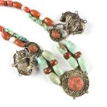 A CHINESE TURQUOISE, CORAL, WHITE JADE, GOLDSTONE, AND PEKING GLASS SILVER PLATED COURT STYLE