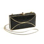 A JUDITH LEIBER BLACK CRYSTAL AND GILT METAL BANDED EVENING CLUTCH, SIGNED, LATE 1980/EARLY 1990,